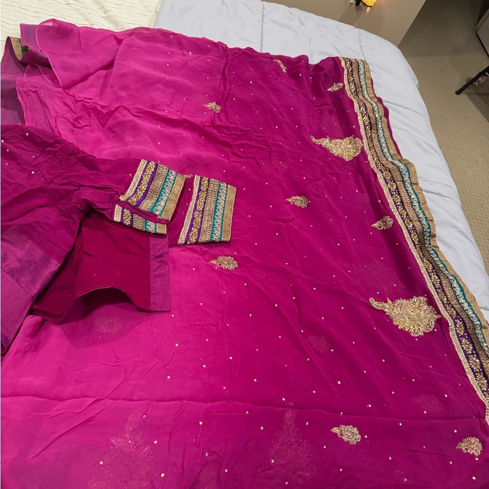 Vibrant Pink Saree with Gold Embellishments